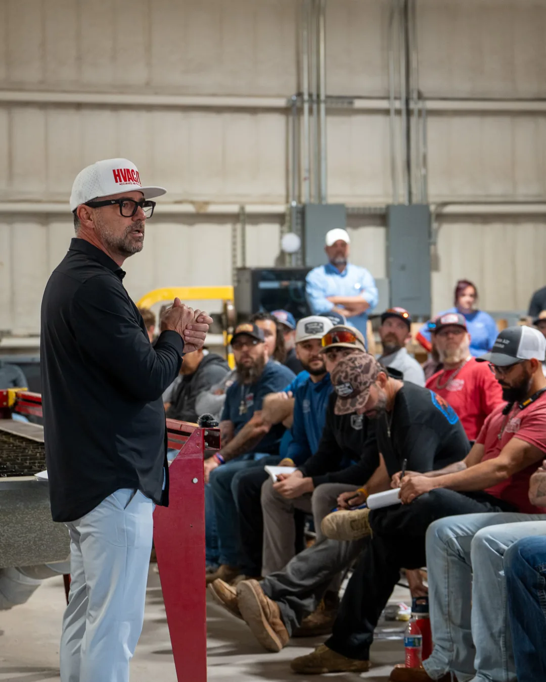 Tom Hawkins and the Hawkins crew in a training meeting
